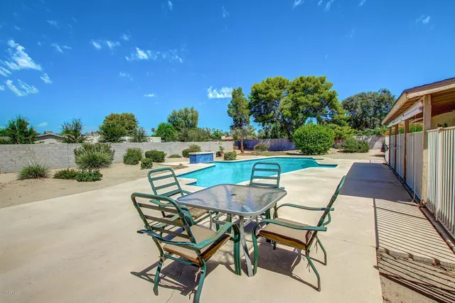 a view of a street with a cars parked side of the road
