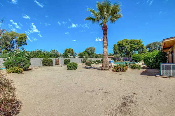 a view of a house with pool porch and sitting area