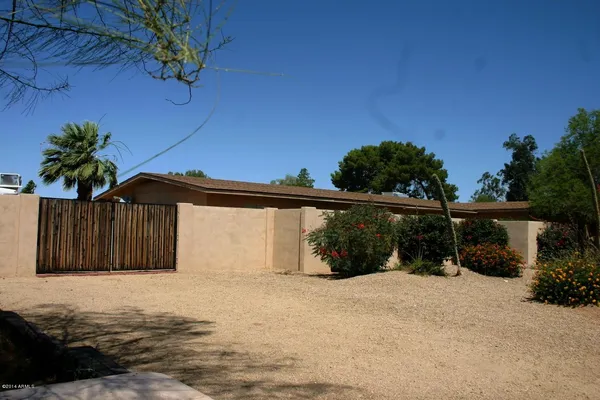 a view of a house with a yard and garage