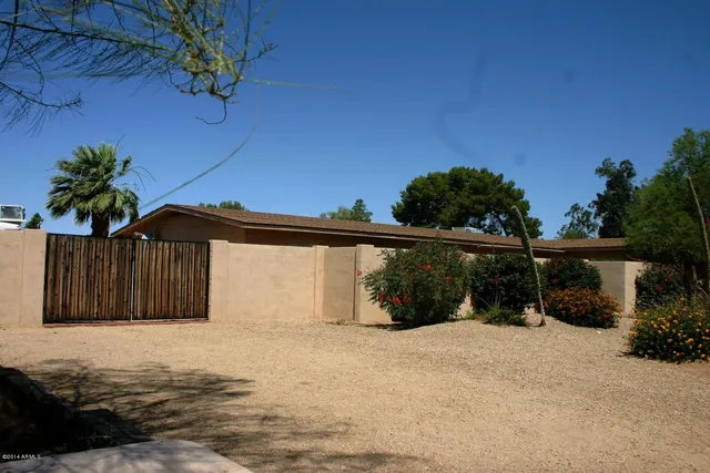 a view of a house with a yard and garage