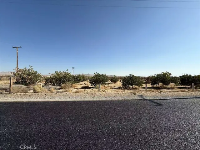 a view of a road with an ocean view