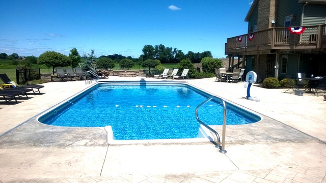 18357 Rodeo Drive Sterling, IL 61081 - Photo 22 of 22 a view of a swimming pool with an outdoor seating and a garden