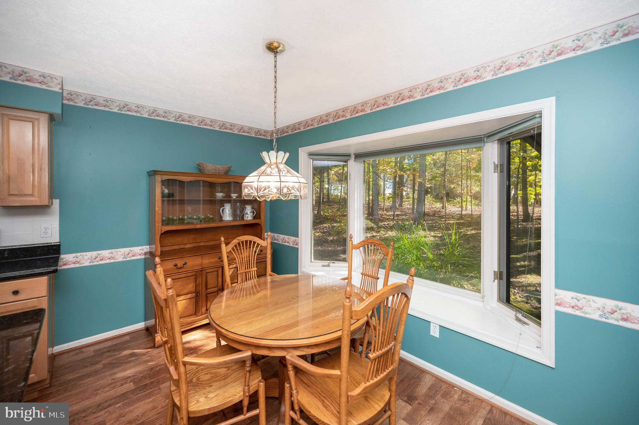 221 Washington Street Locust Grove, VA 22508 - Photo 13 of 48 a view of a dining room with furniture window and wooden floor