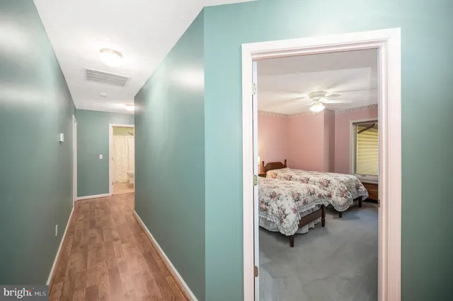 a bedroom with a bed and a mirror