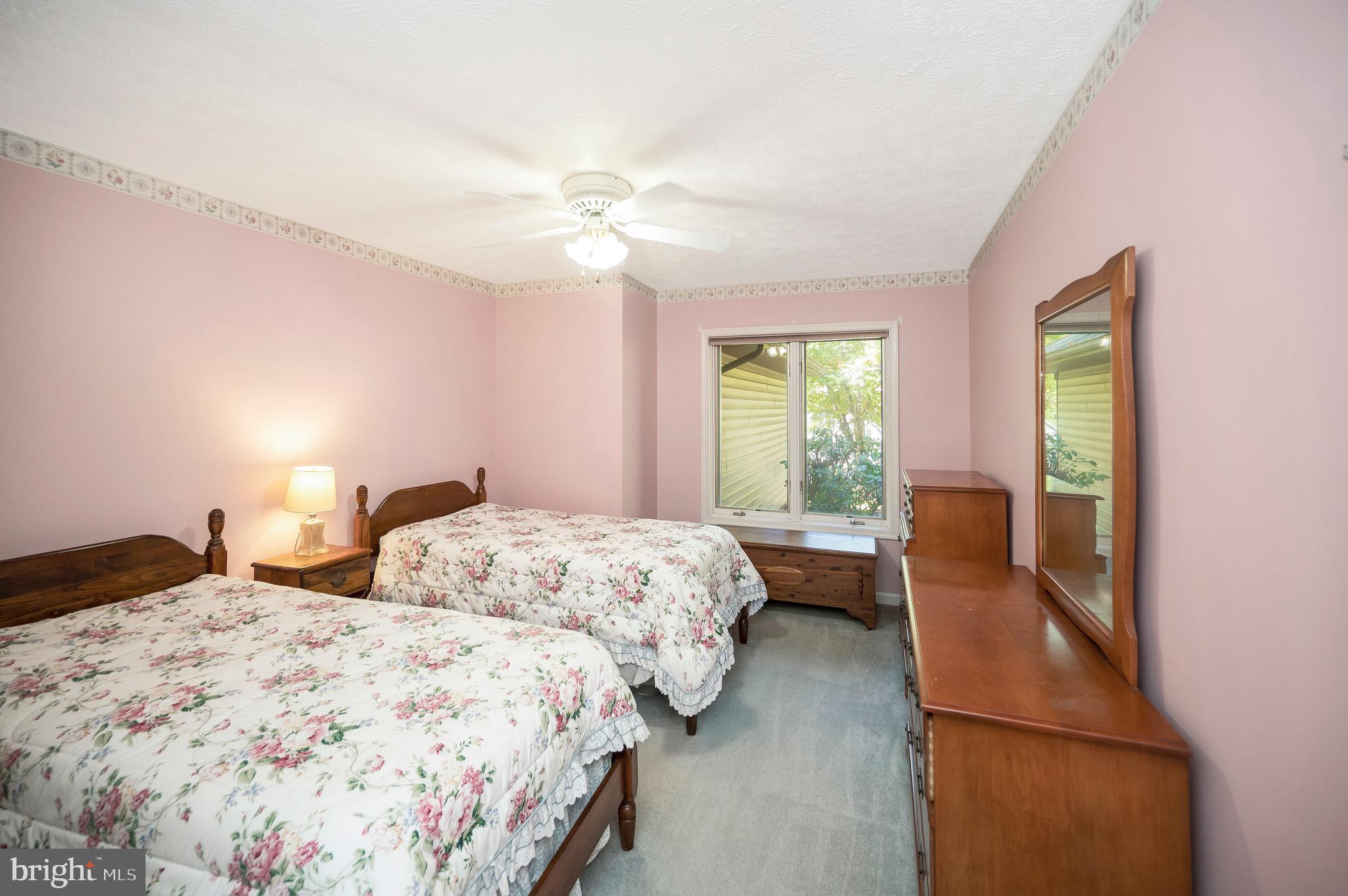 221 Washington Street Locust Grove, VA 22508 - Photo 20 of 48 a bedroom with two beds and a chandelier