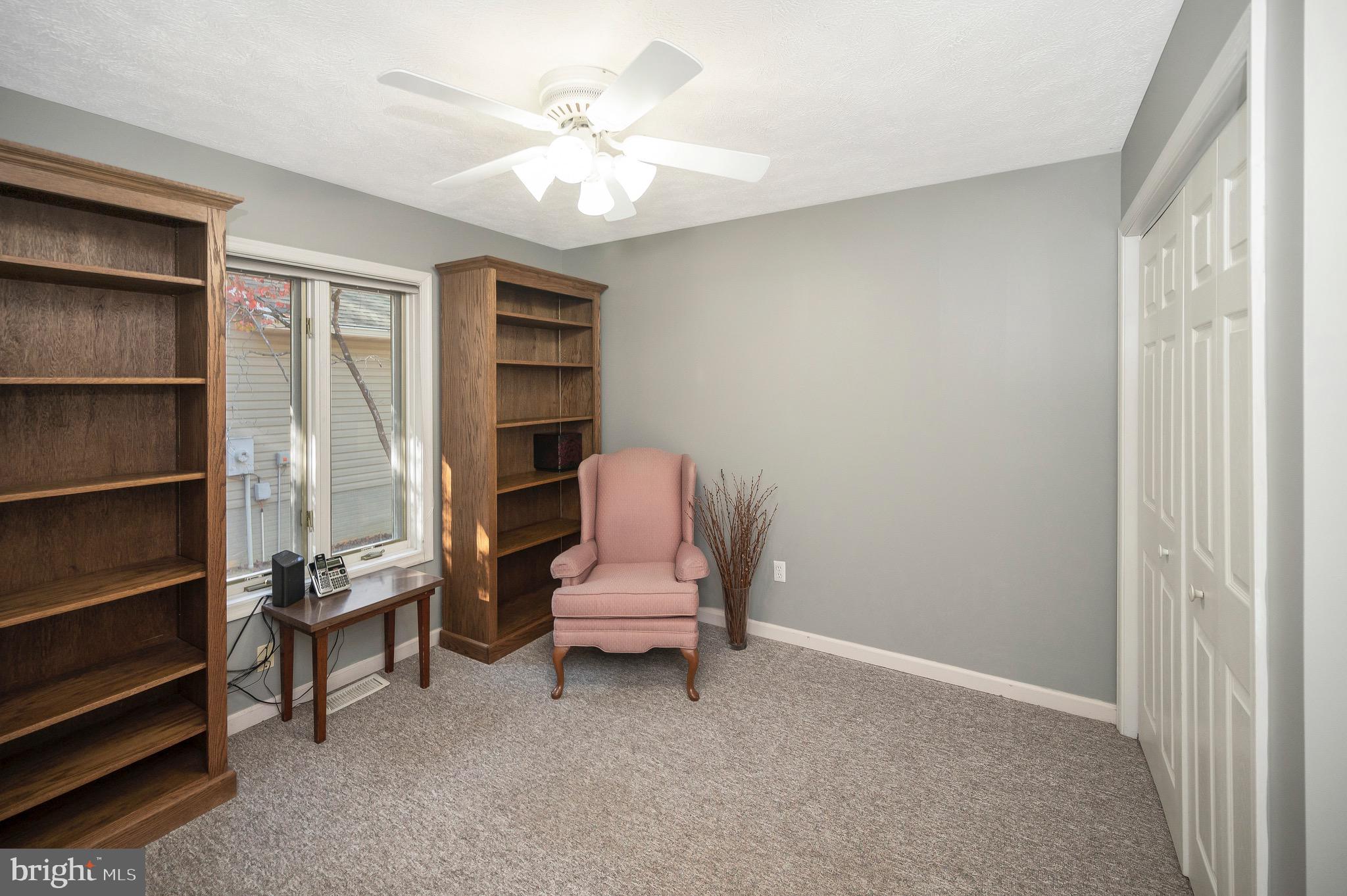 221 Washington Street Locust Grove, VA 22508 - Photo 22 of 48 a living room with furniture and a chair