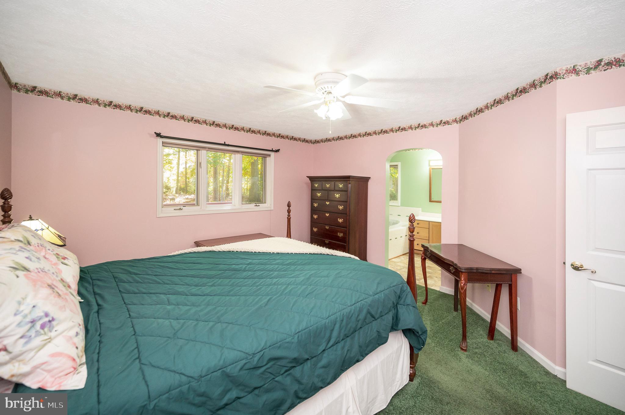 221 Washington Street Locust Grove, VA 22508 - Photo 25 of 48 a bedroom with a bed and a dresser next to a window