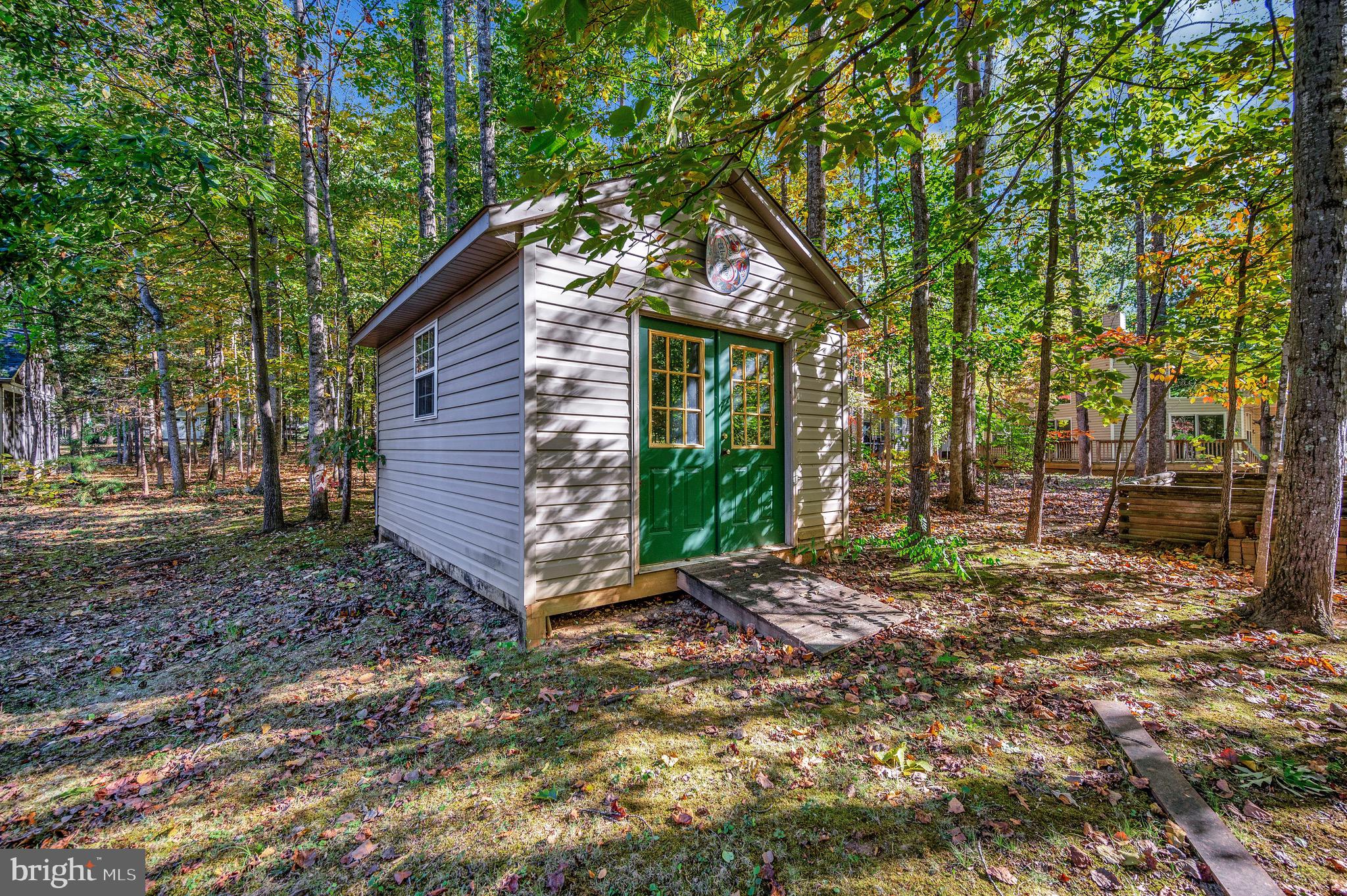 221 Washington Street Locust Grove, VA 22508 - Photo 30 of 48 a view of a house with a yard and tree s