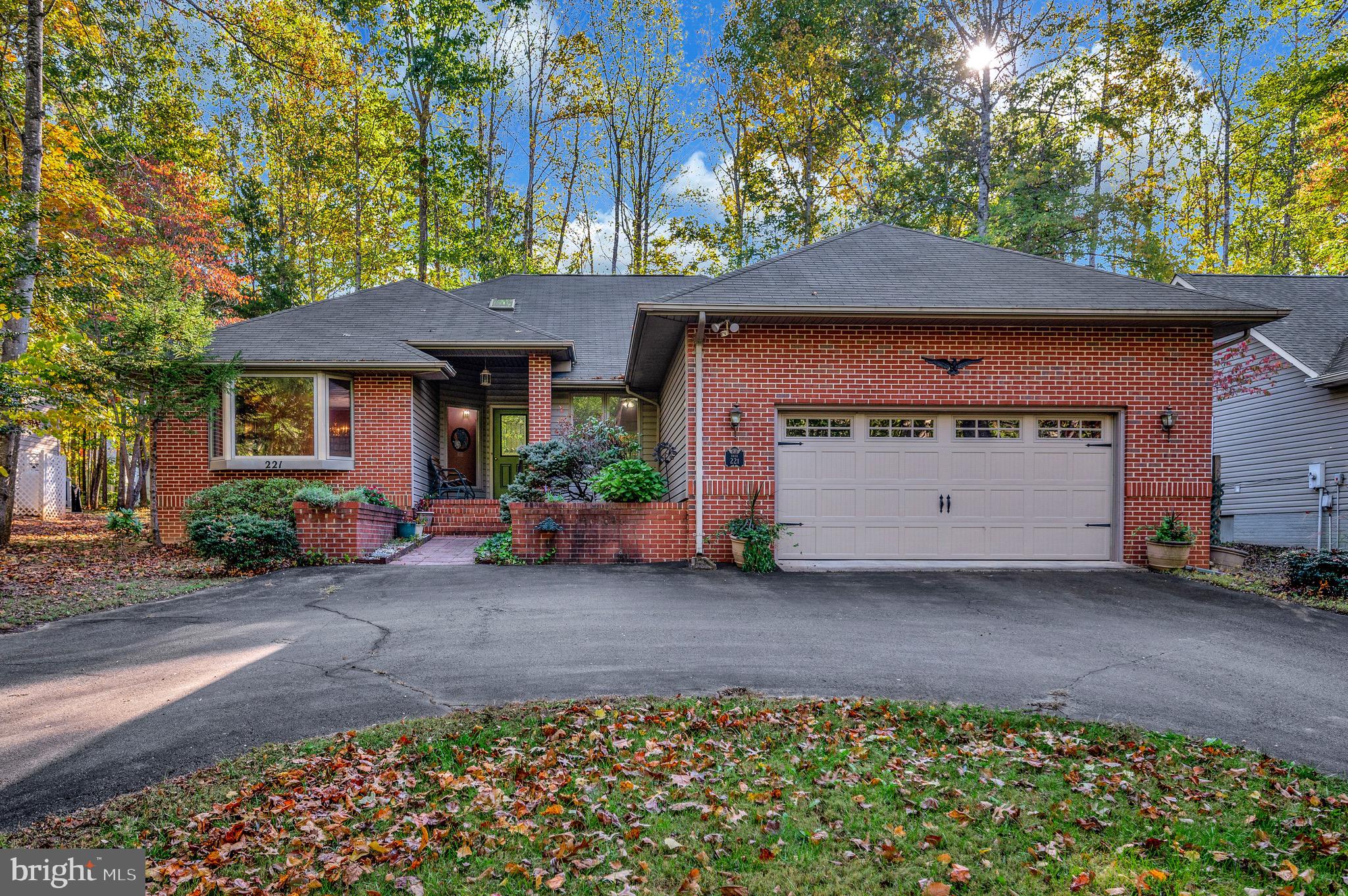 221 Washington Street Locust Grove, VA 22508 - Photo 33 of 48 a front view of a house with a garden
