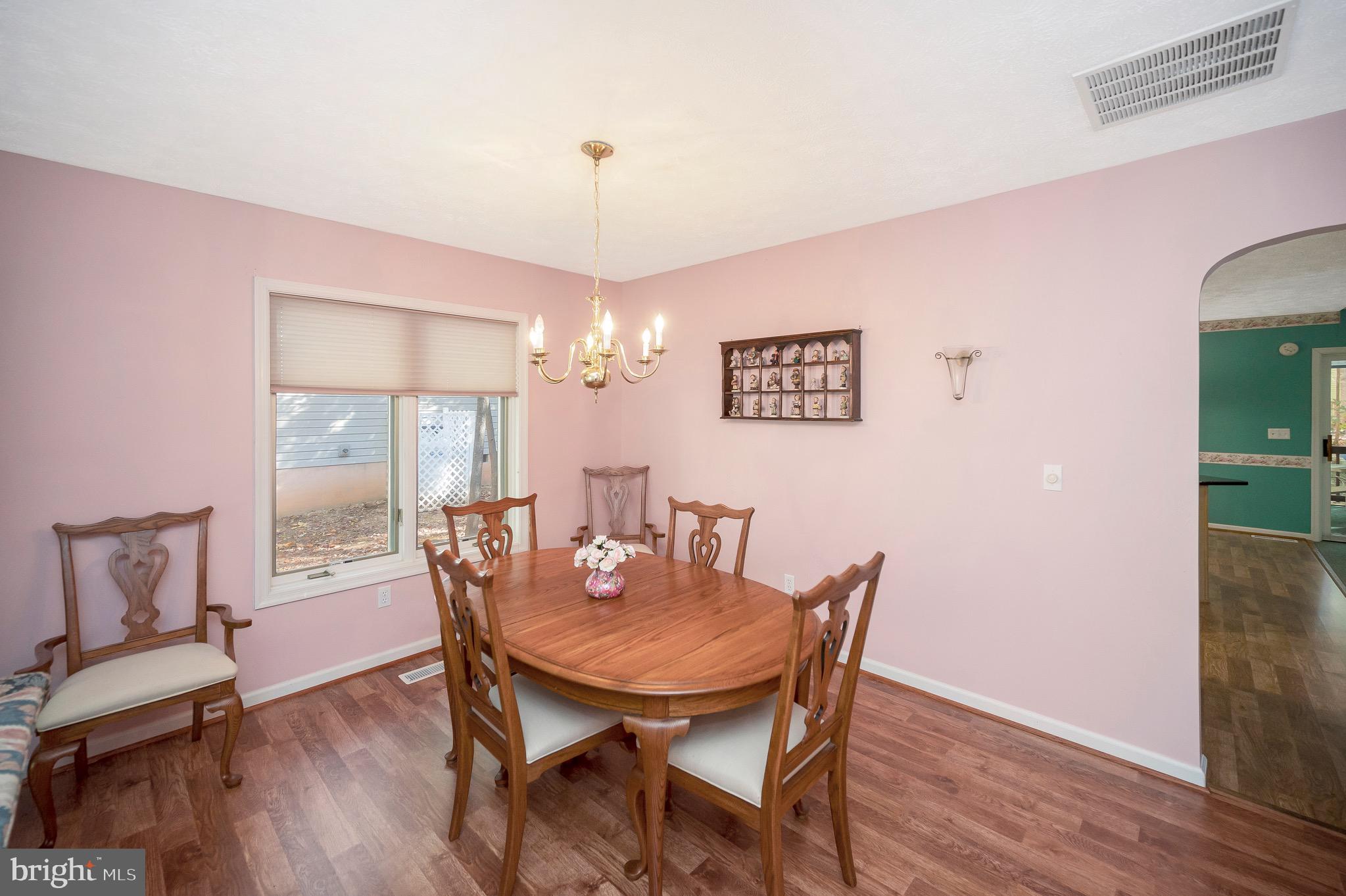 221 Washington Street Locust Grove, VA 22508 - Photo 5 of 48 a view of a dining room with furniture window and wooden floor