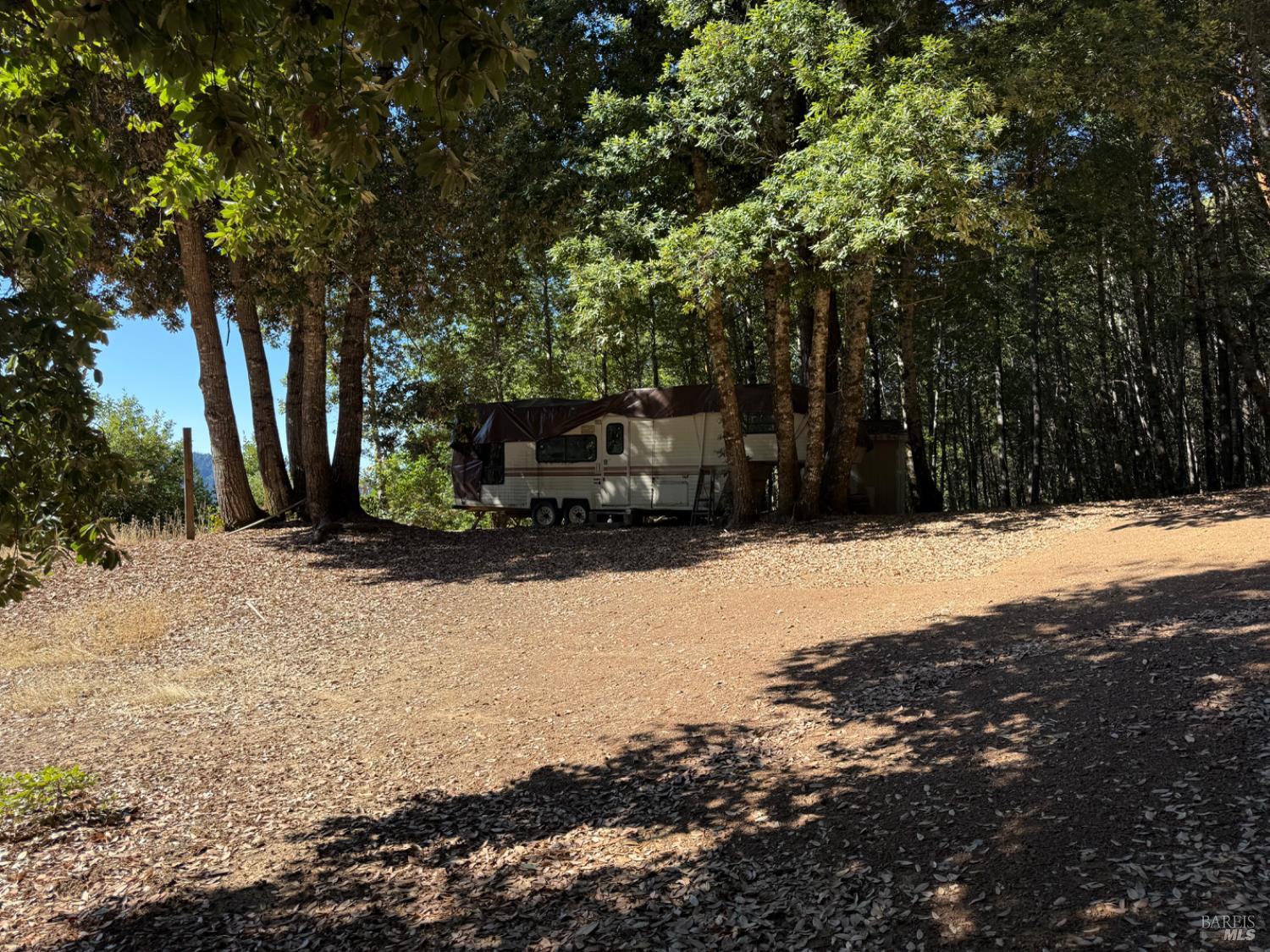 a view of snow on the side of the road