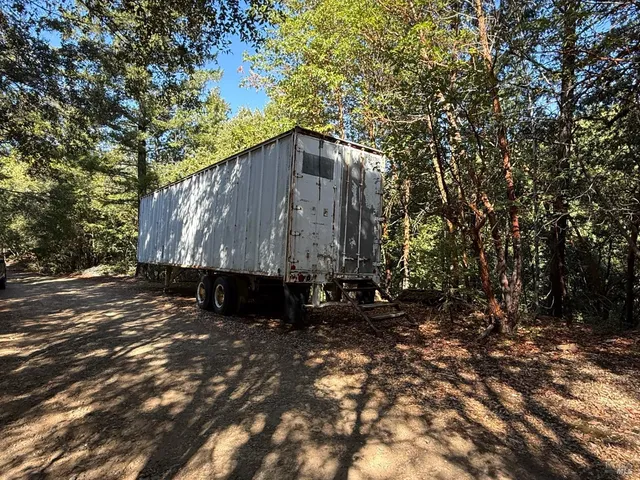 a view of a house with a tree