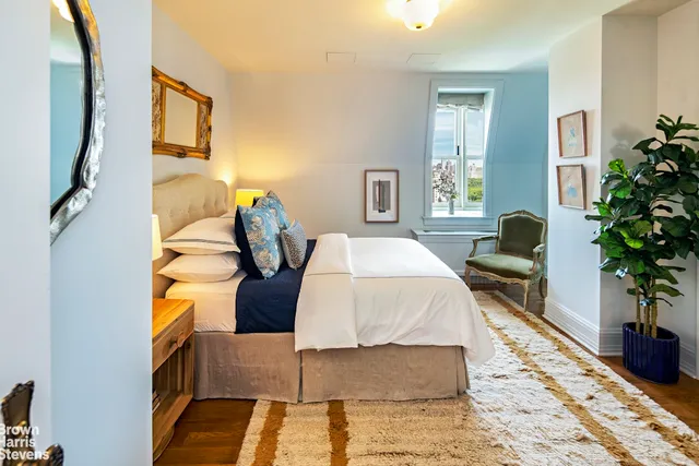 a bedroom with a bed and a closet