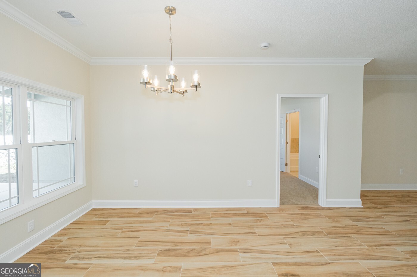 214 The Villas Way Kingsland, GA 31548 - Photo 11 of 47 a view of empty room with wooden floor and fan