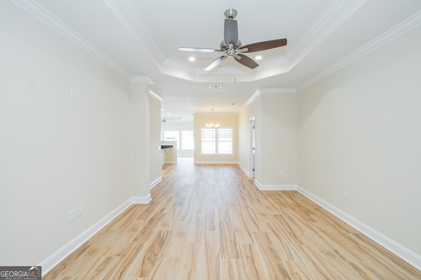 214 The Villas Way Kingsland, GA 31548 - Photo 16 of 47 a view of a room with wooden floor ceiling fan