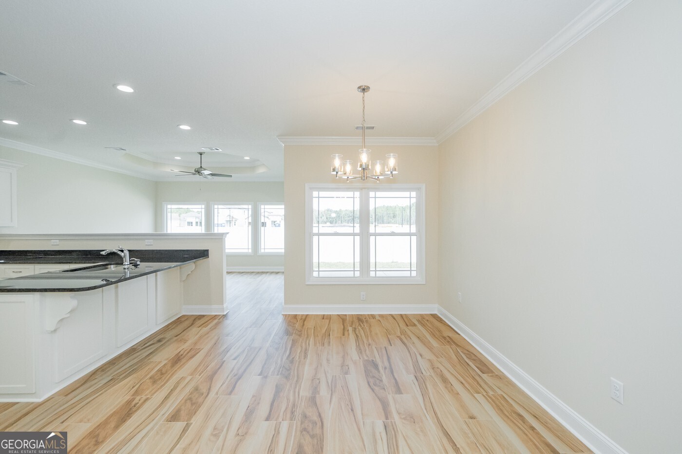 214 The Villas Way Kingsland, GA 31548 - Photo 20 of 47 a view of a kitchen with granite countertop wooden floor stainless steel appliances and a sink
