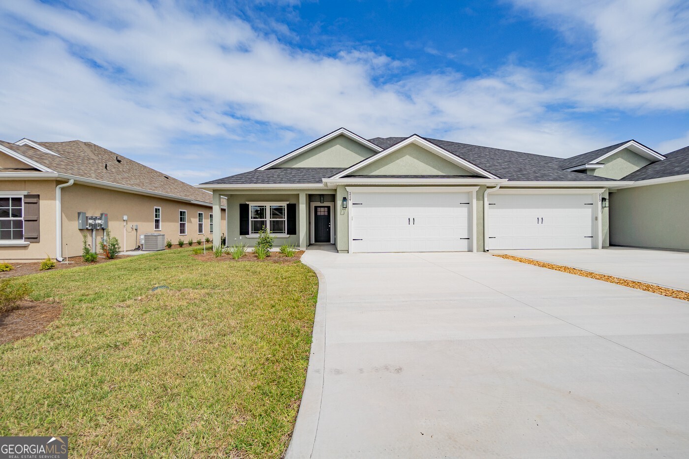 214 The Villas Way Kingsland, GA 31548 - Photo 2 of 47 a house with trees in the background
