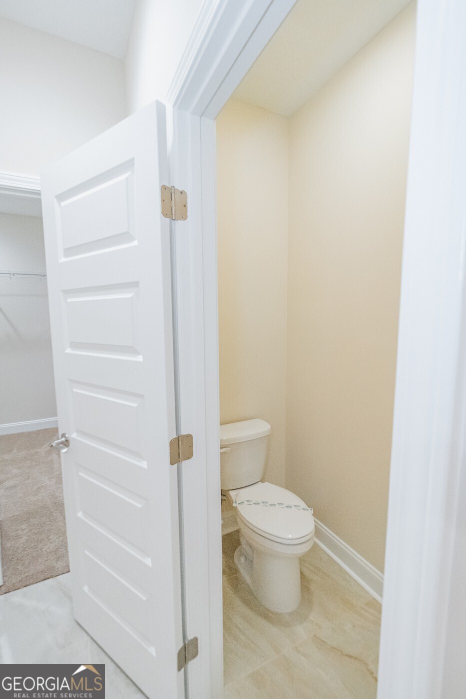 214 The Villas Way Kingsland, GA 31548 - Photo 28 of 47 a white toilet sitting next to a shower