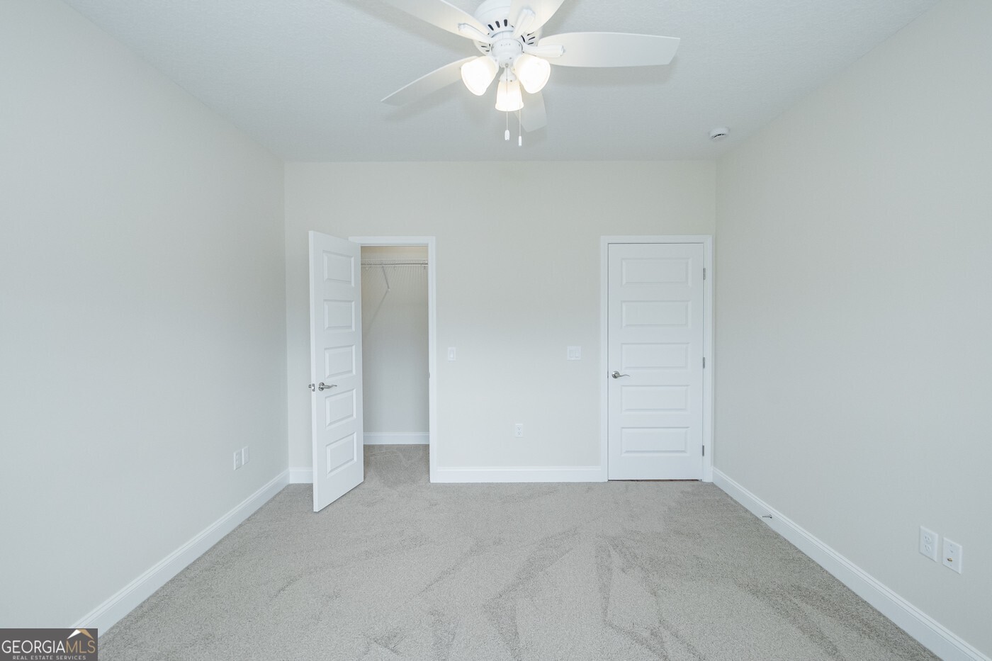 214 The Villas Way Kingsland, GA 31548 - Photo 32 of 47 an empty room with a ceiling fan and a window
