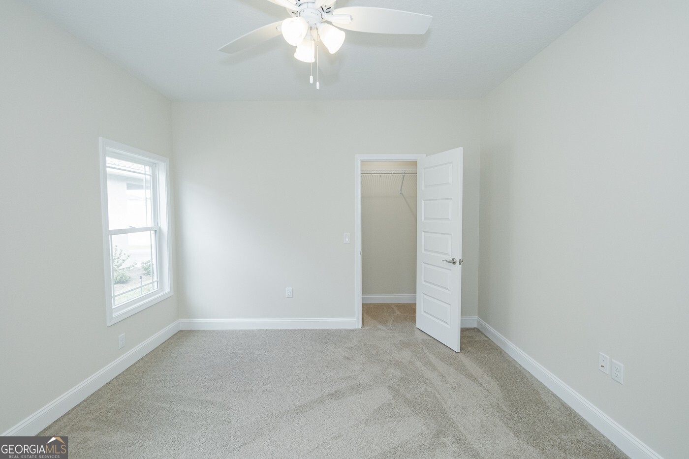 214 The Villas Way Kingsland, GA 31548 - Photo 38 of 47 an empty room with windows and fan