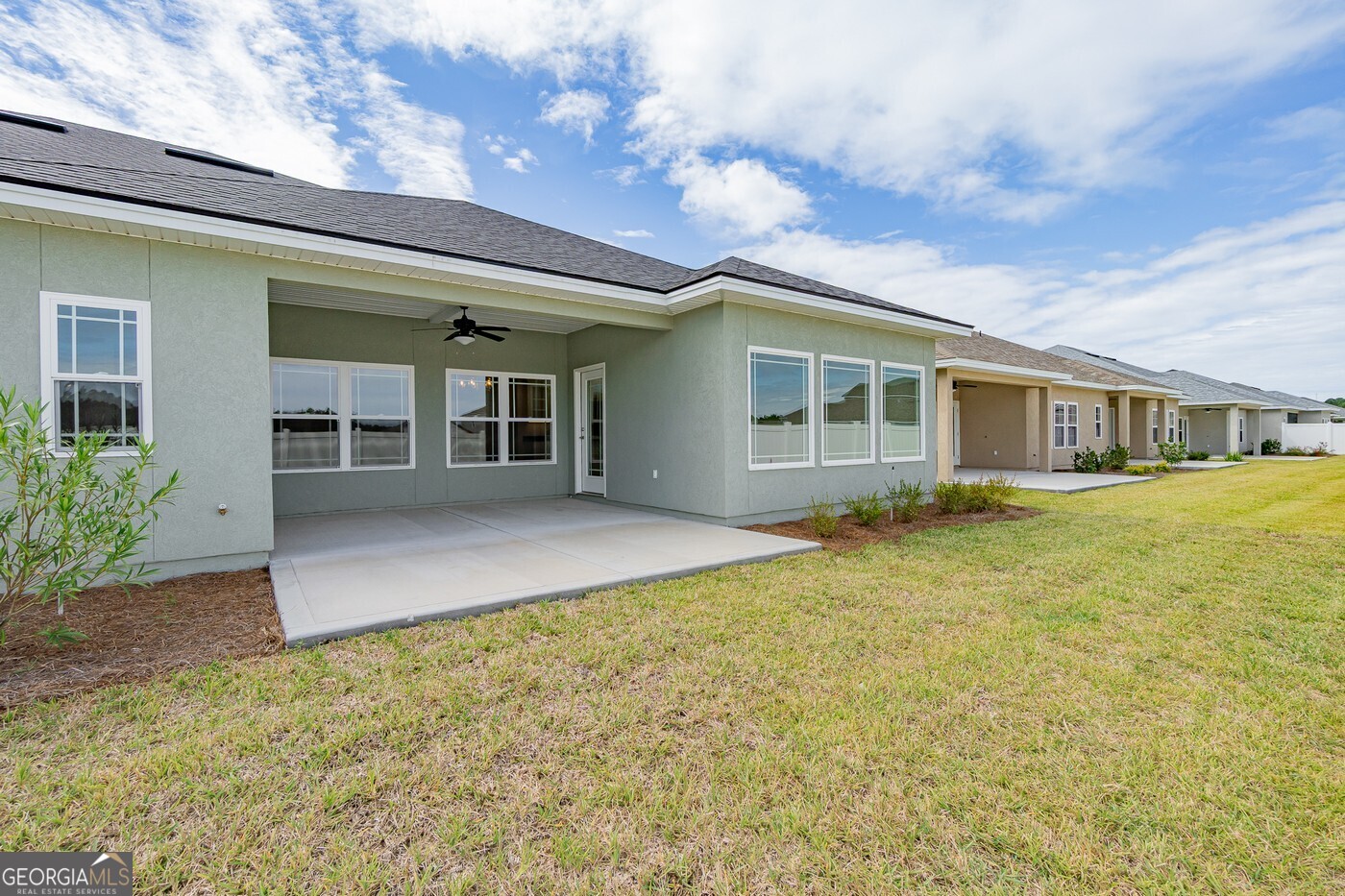 214 The Villas Way Kingsland, GA 31548 - Photo 46 of 47 front view of a house with a yard