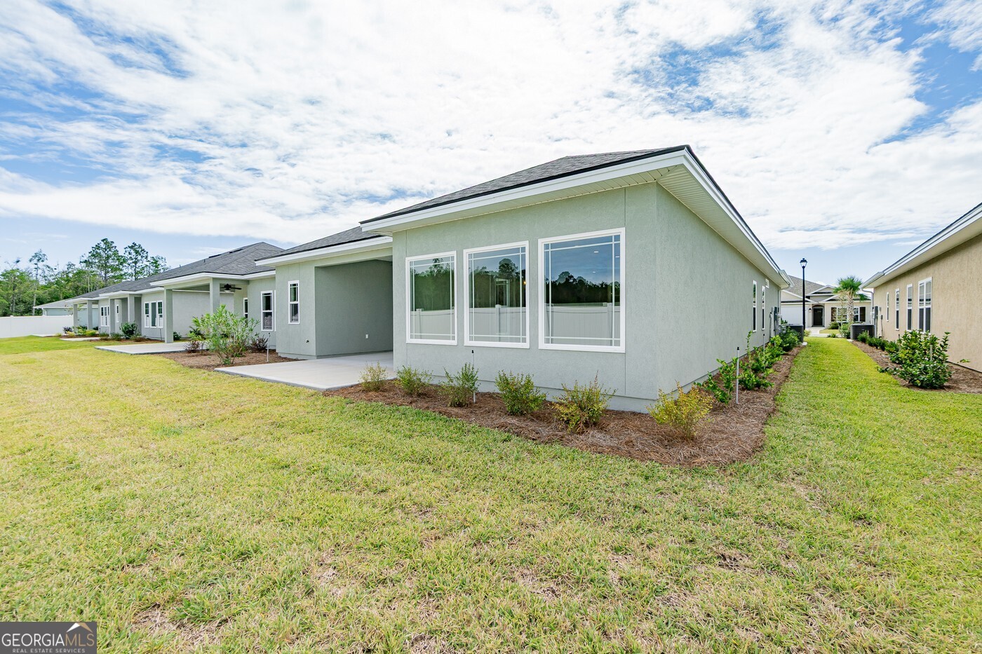 214 The Villas Way Kingsland, GA 31548 - Photo 47 of 47 a house with trees in front of it