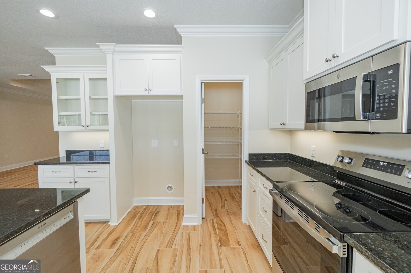 214 The Villas Way Kingsland, GA 31548 - Photo 9 of 47 a kitchen with a stove and a microwave