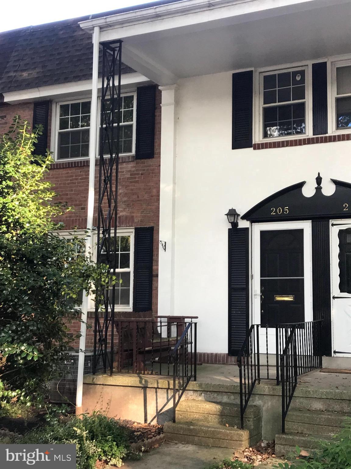 205 Sycamore Road Reading, PA 19611 - Photo 2 of 8 a front view of house with a garden