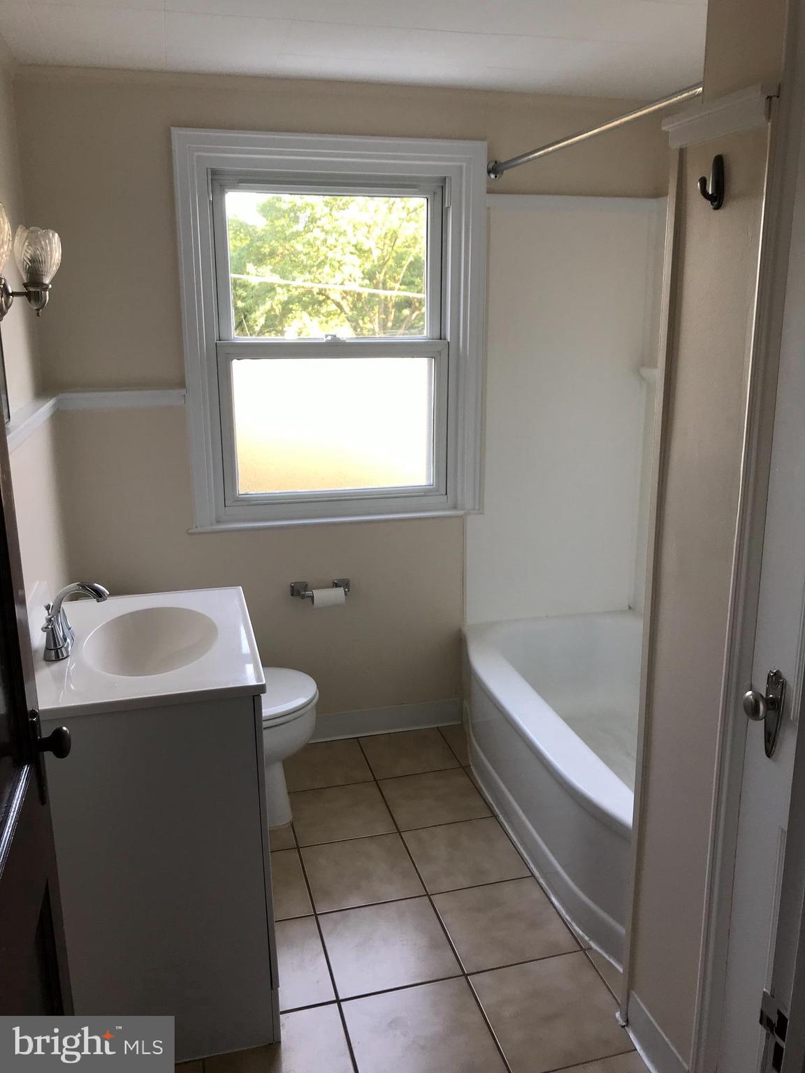 205 Sycamore Road Reading, PA 19611 - Photo 6 of 8 a bathroom with a sink toilet and shower