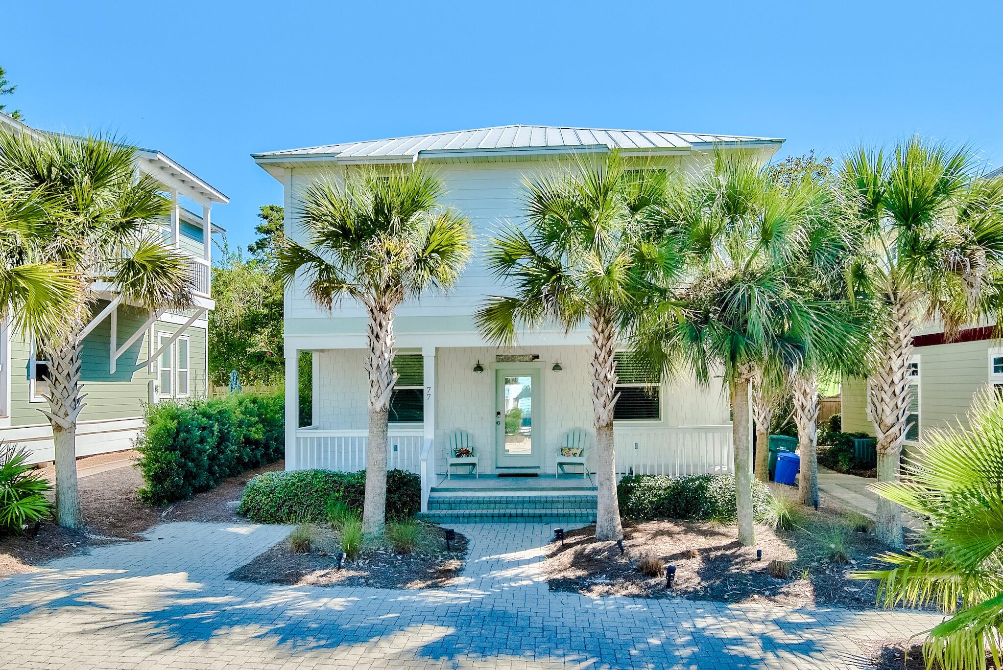 77 Snapper Street Santa Rosa Beach, FL 32459 - Photo 1 of 54 a front view of a house with garden