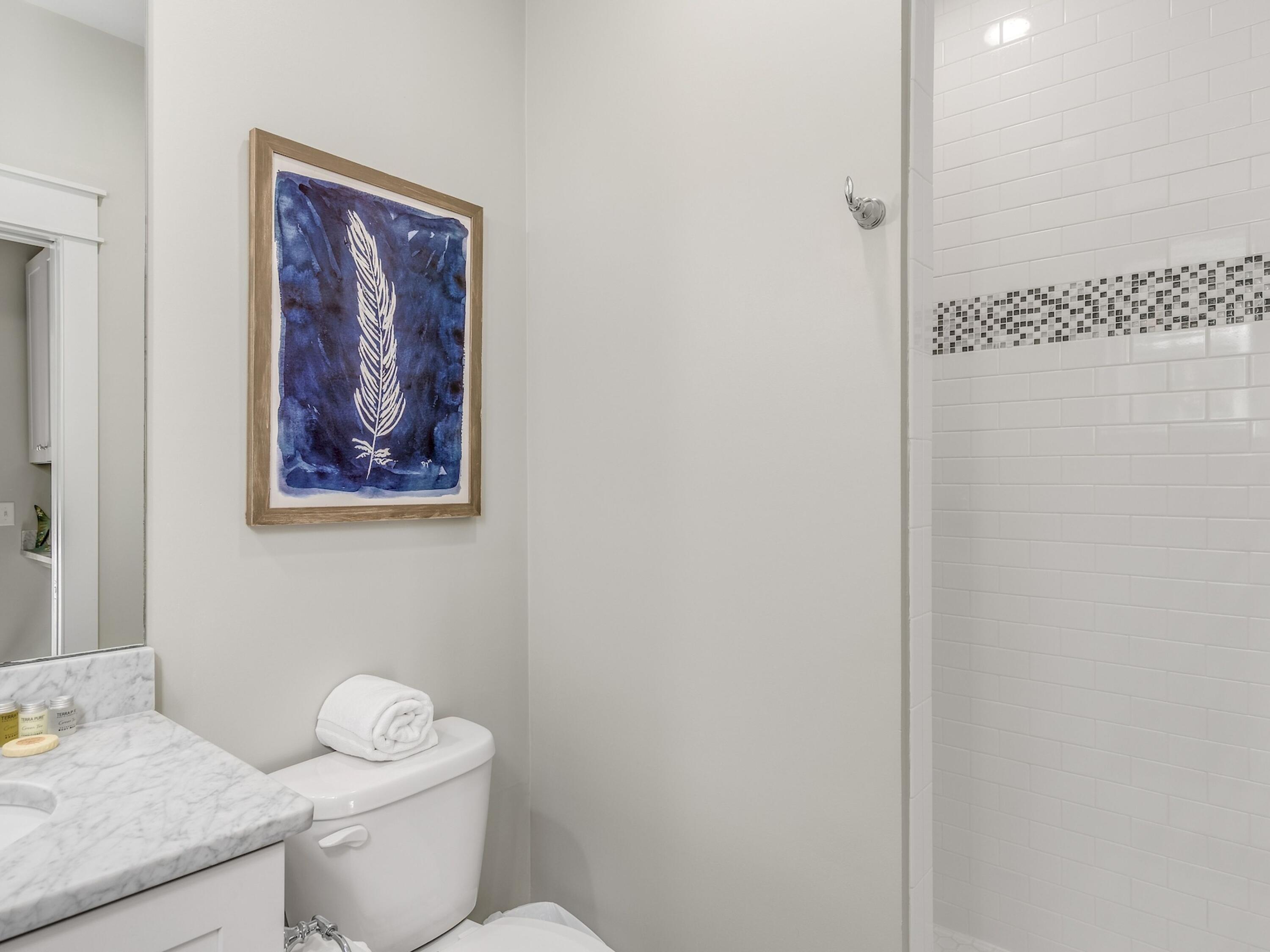 77 Snapper Street Santa Rosa Beach, FL 32459 - Photo 19 of 54 a white toilet sitting next to a bathroom sink
