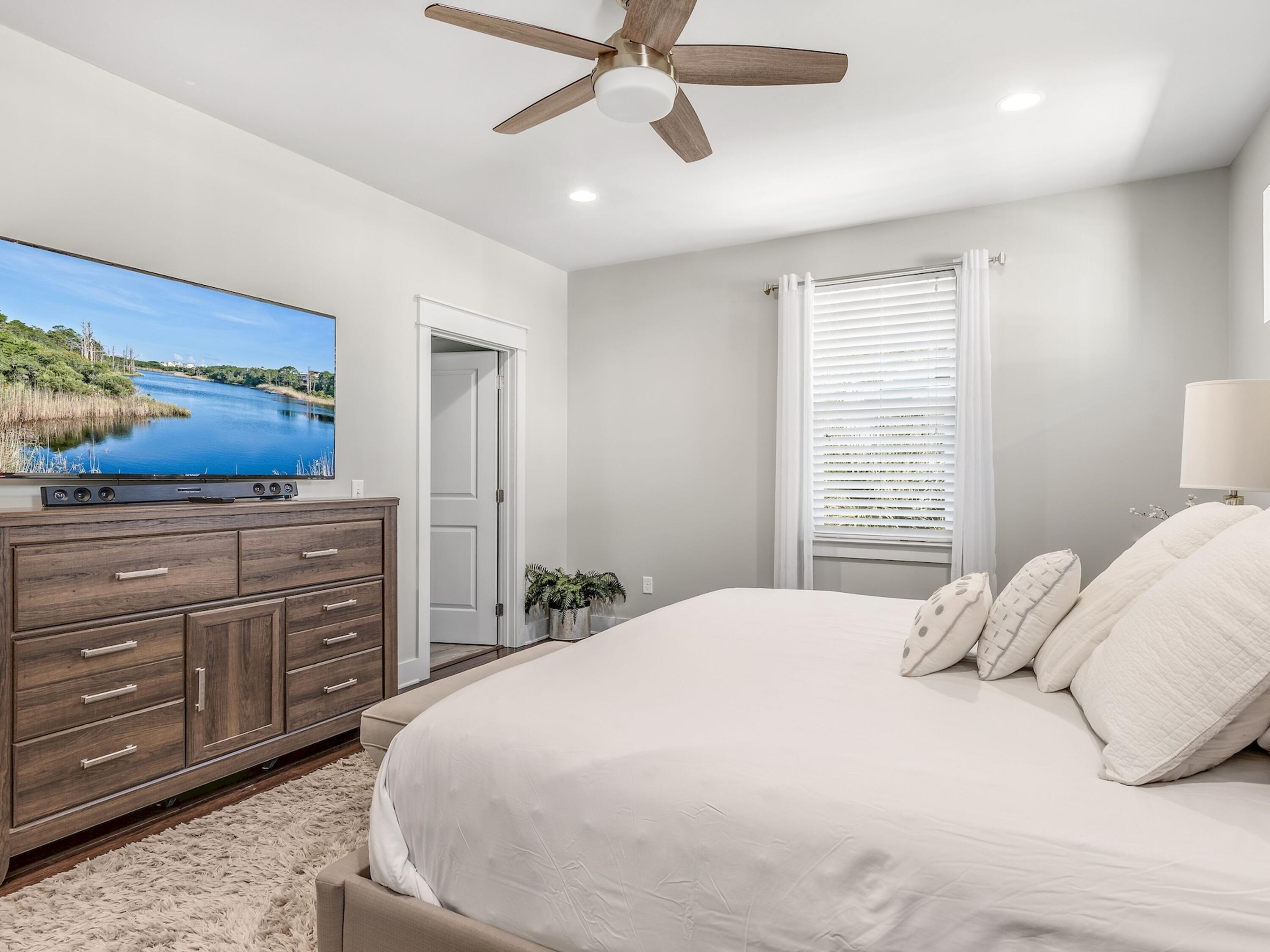 77 Snapper Street Santa Rosa Beach, FL 32459 - Photo 21 of 54 a bedroom with a bed and a dresser