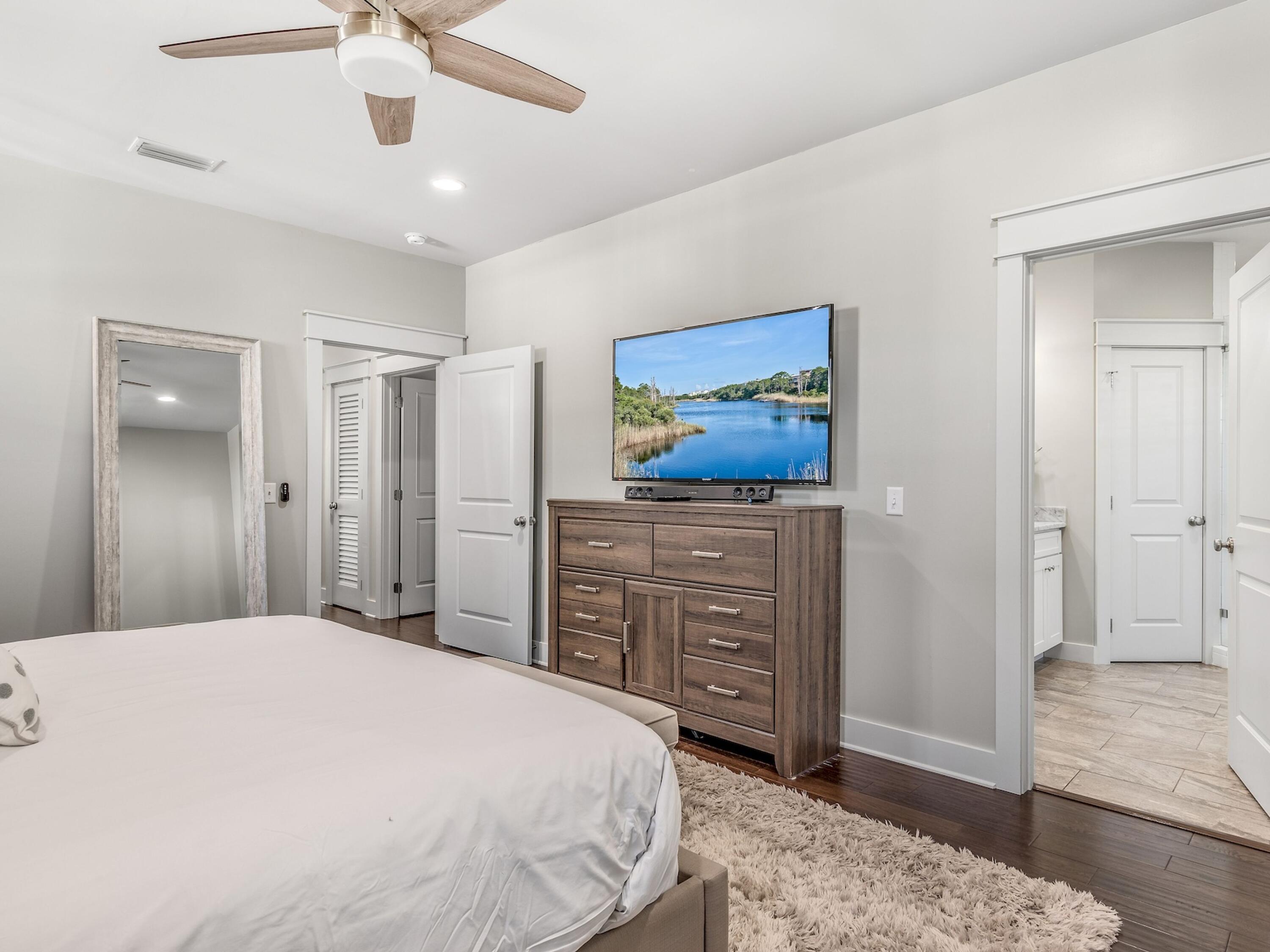 77 Snapper Street Santa Rosa Beach, FL 32459 - Photo 22 of 54 a bedroom with a bed and a dresser