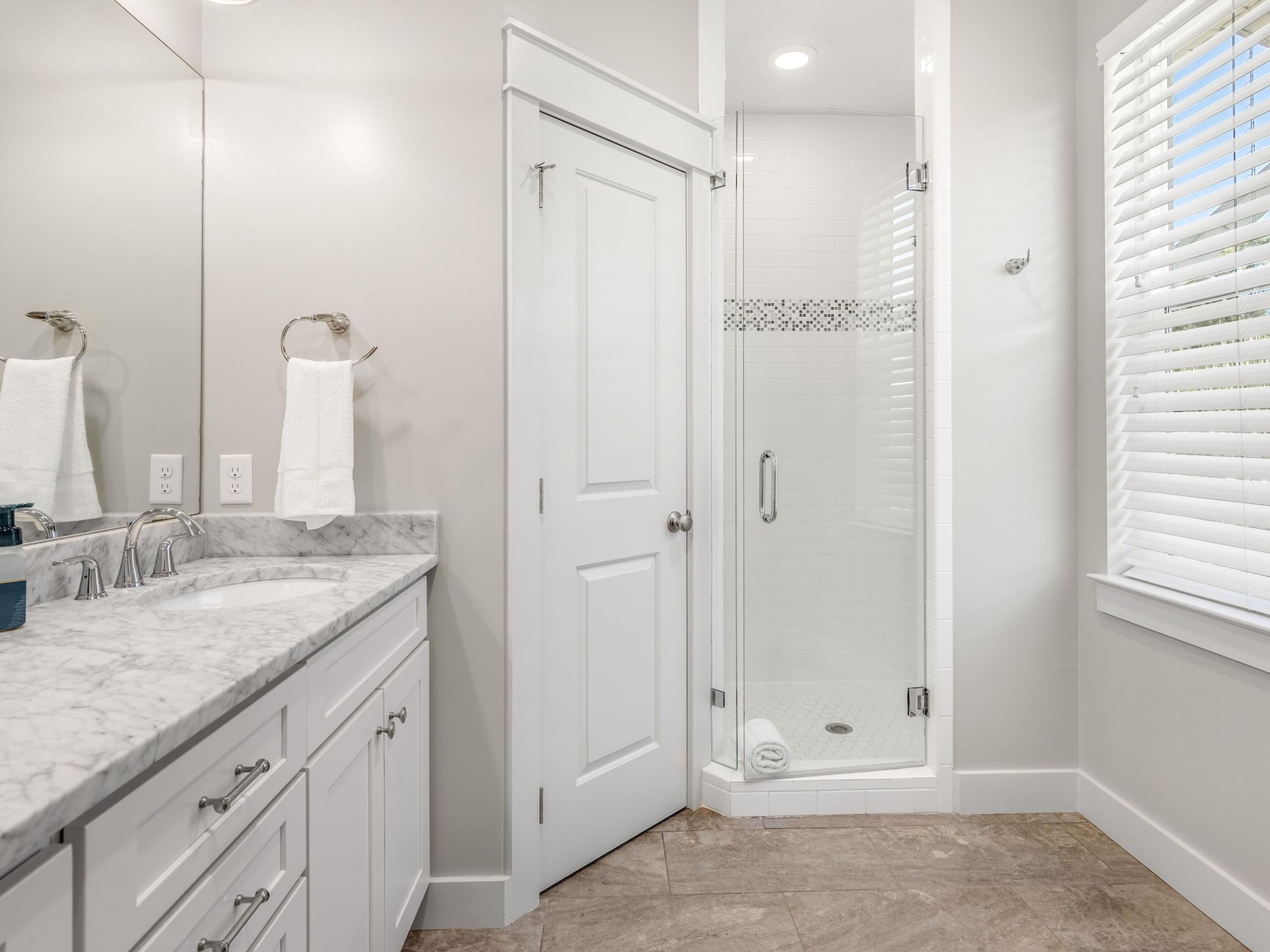 77 Snapper Street Santa Rosa Beach, FL 32459 - Photo 24 of 54 a bathroom with a granite countertop sink two mirror and shower
