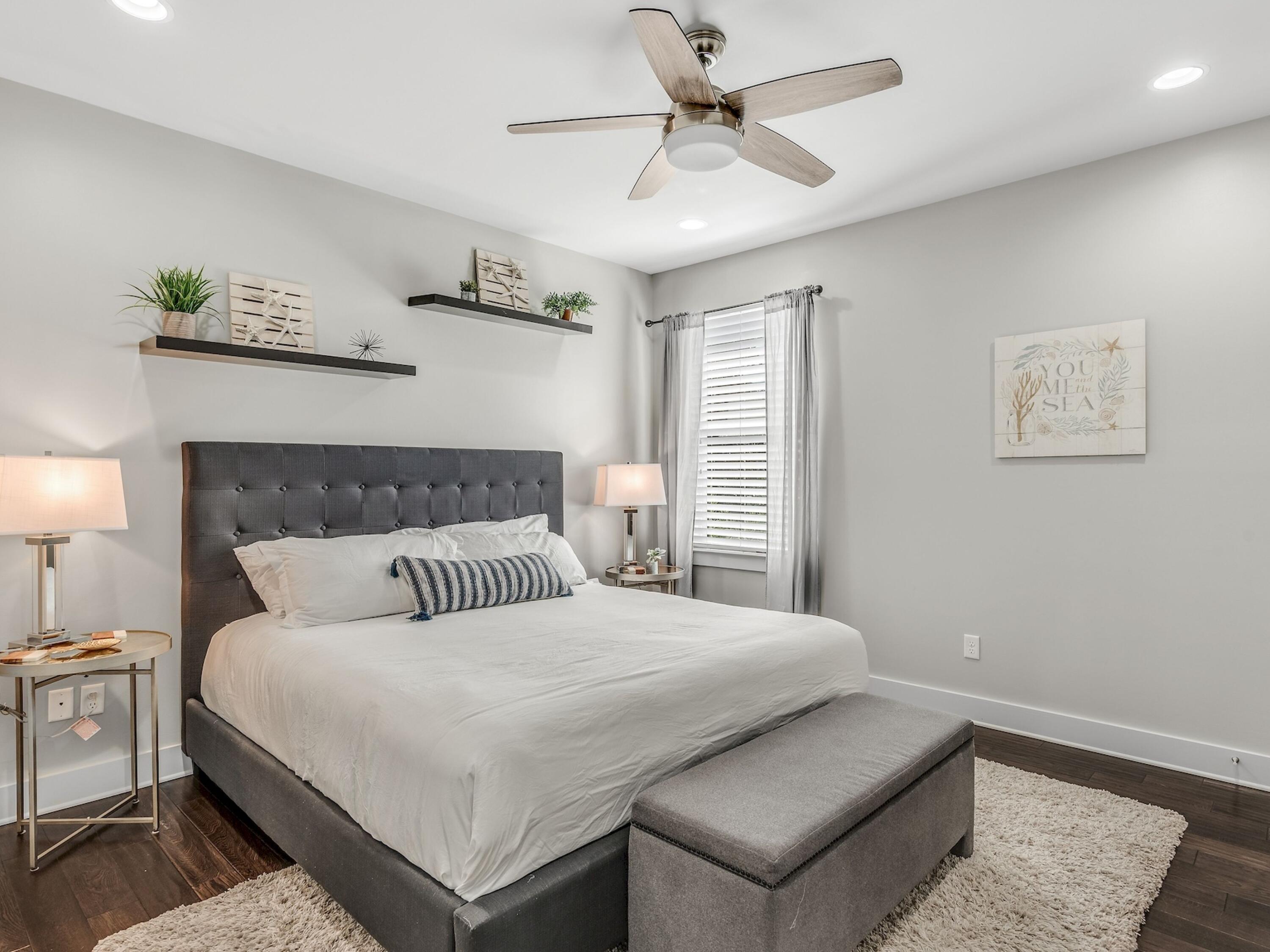 77 Snapper Street Santa Rosa Beach, FL 32459 - Photo 25 of 54 a bedroom with a large bed and a lamp