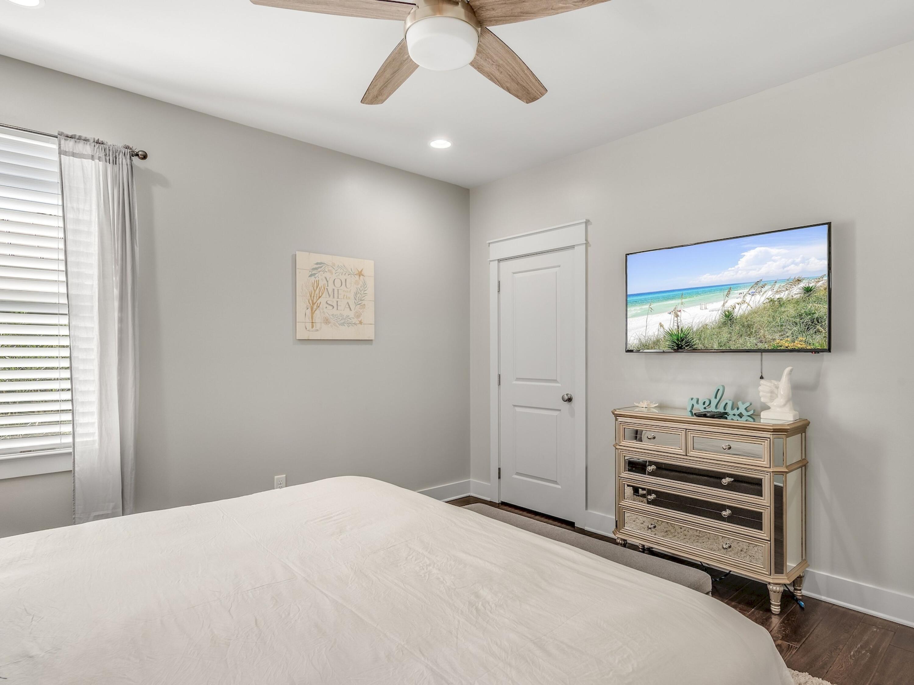 77 Snapper Street Santa Rosa Beach, FL 32459 - Photo 26 of 54 a bedroom with a bed and a flat screen tv