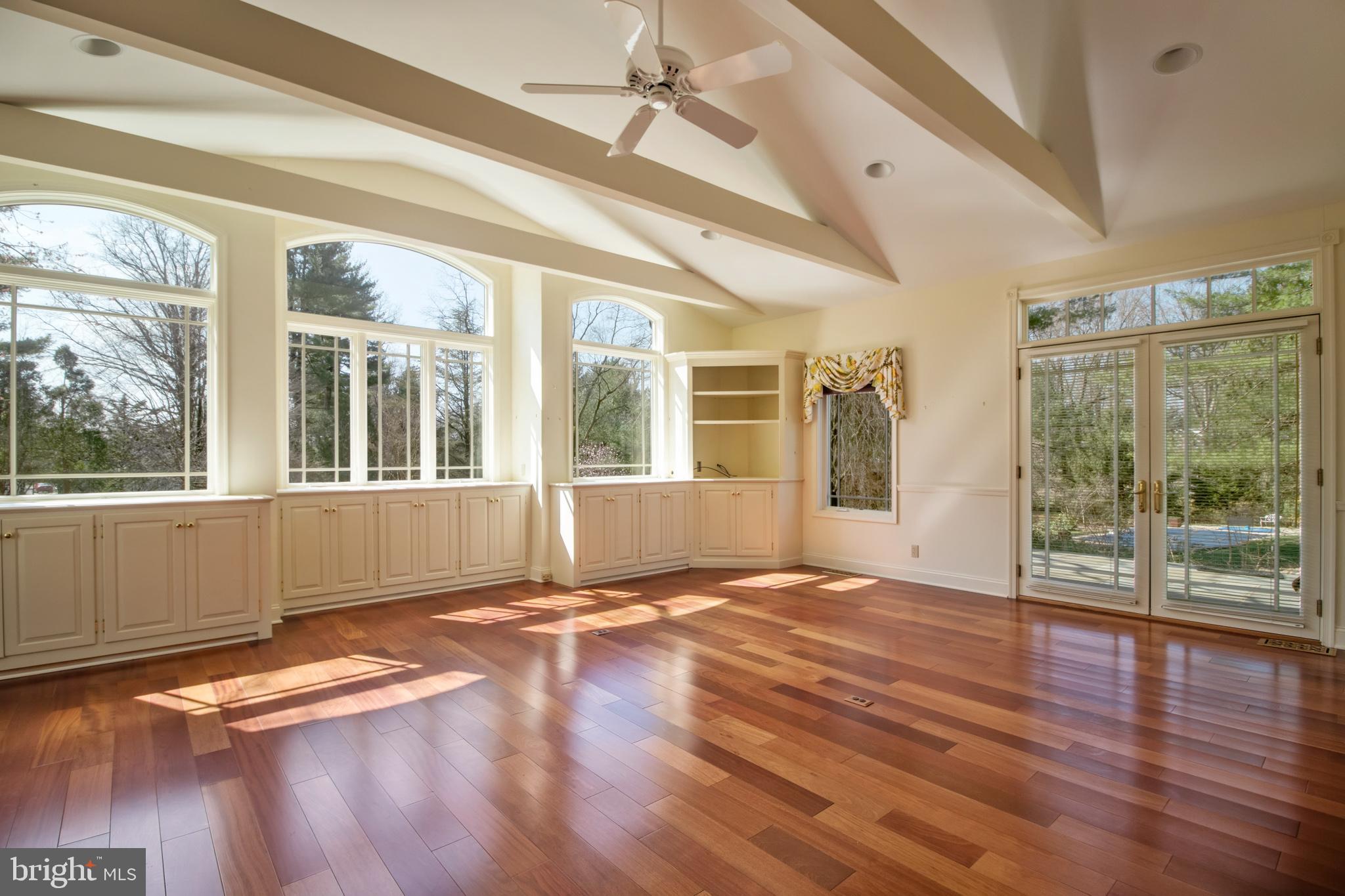 100 Steeplechase Road Devon, PA 19333 - Photo 8 of 33 Great Room - Door Open to Raised Flagstone Patio