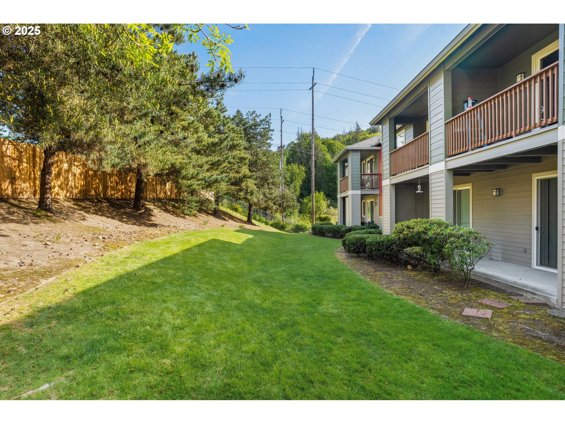 4540 Southwest 11th Street Gresham, OR 97080 - Photo 22 of 27 a view of a house with a yard