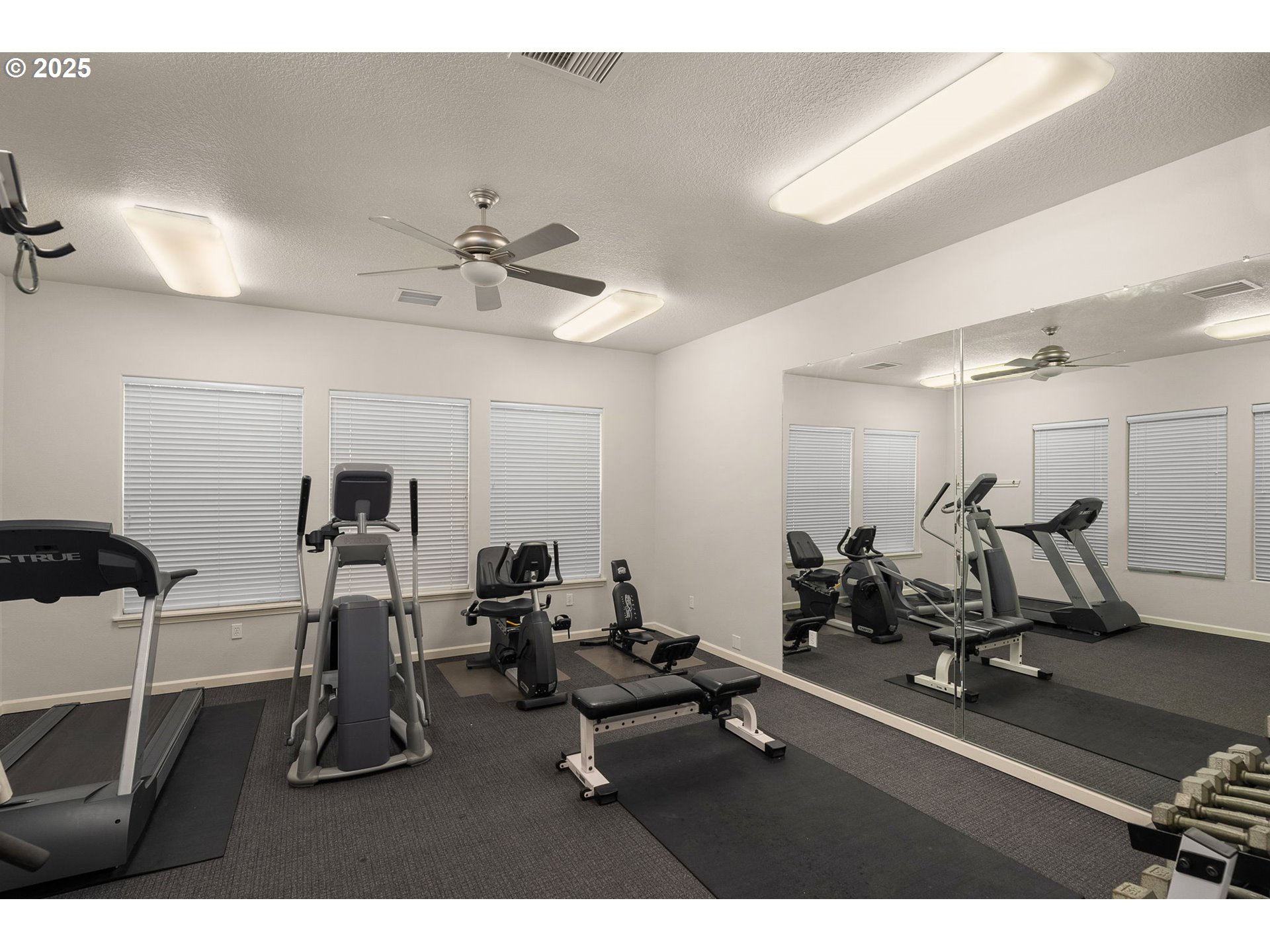 4540 Southwest 11th Street Gresham, OR 97080 - Photo 26 of 27 a room with gym equipment and windows