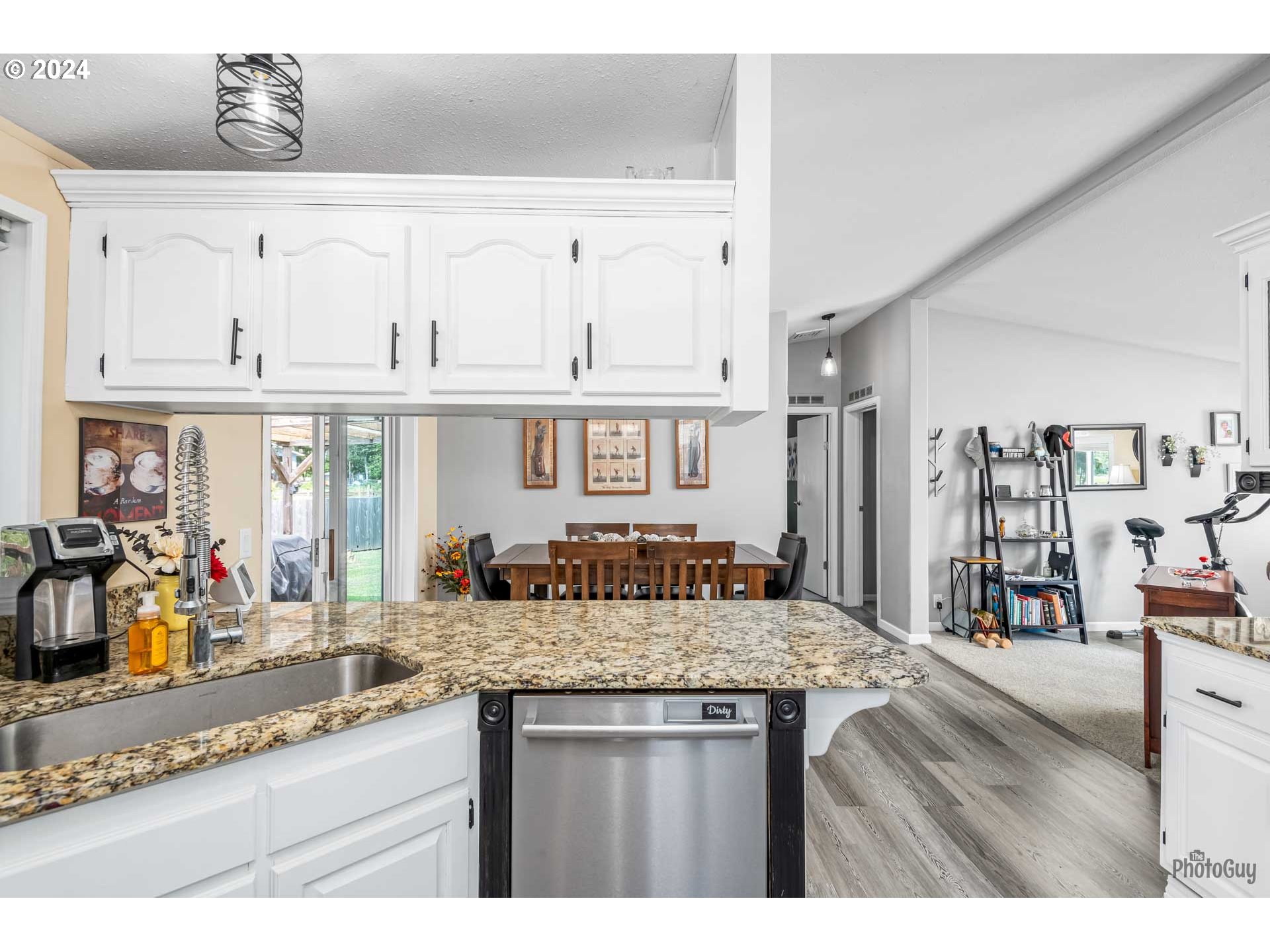 90640 Marcola Road Springfield, OR 97478 - Photo 14 of 40 a kitchen with granite countertop a sink and a wooden floors
