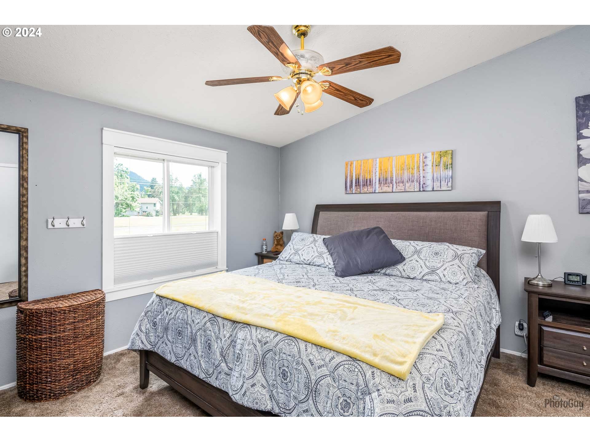 90640 Marcola Road Springfield, OR 97478 - Photo 16 of 40 a bed sitting in a bedroom next to a window