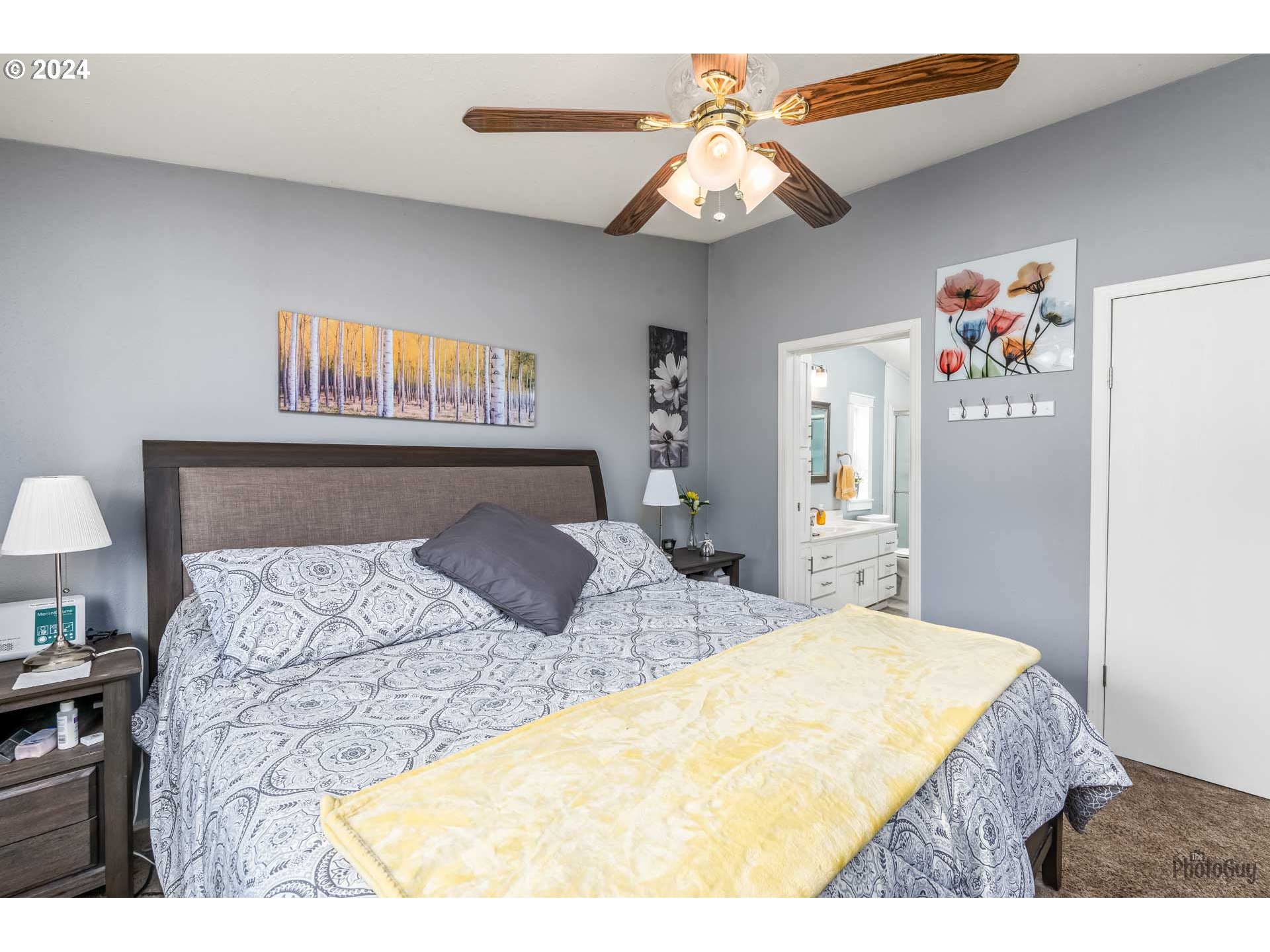 90640 Marcola Road Springfield, OR 97478 - Photo 17 of 40 a bedroom with a bed and a chandelier