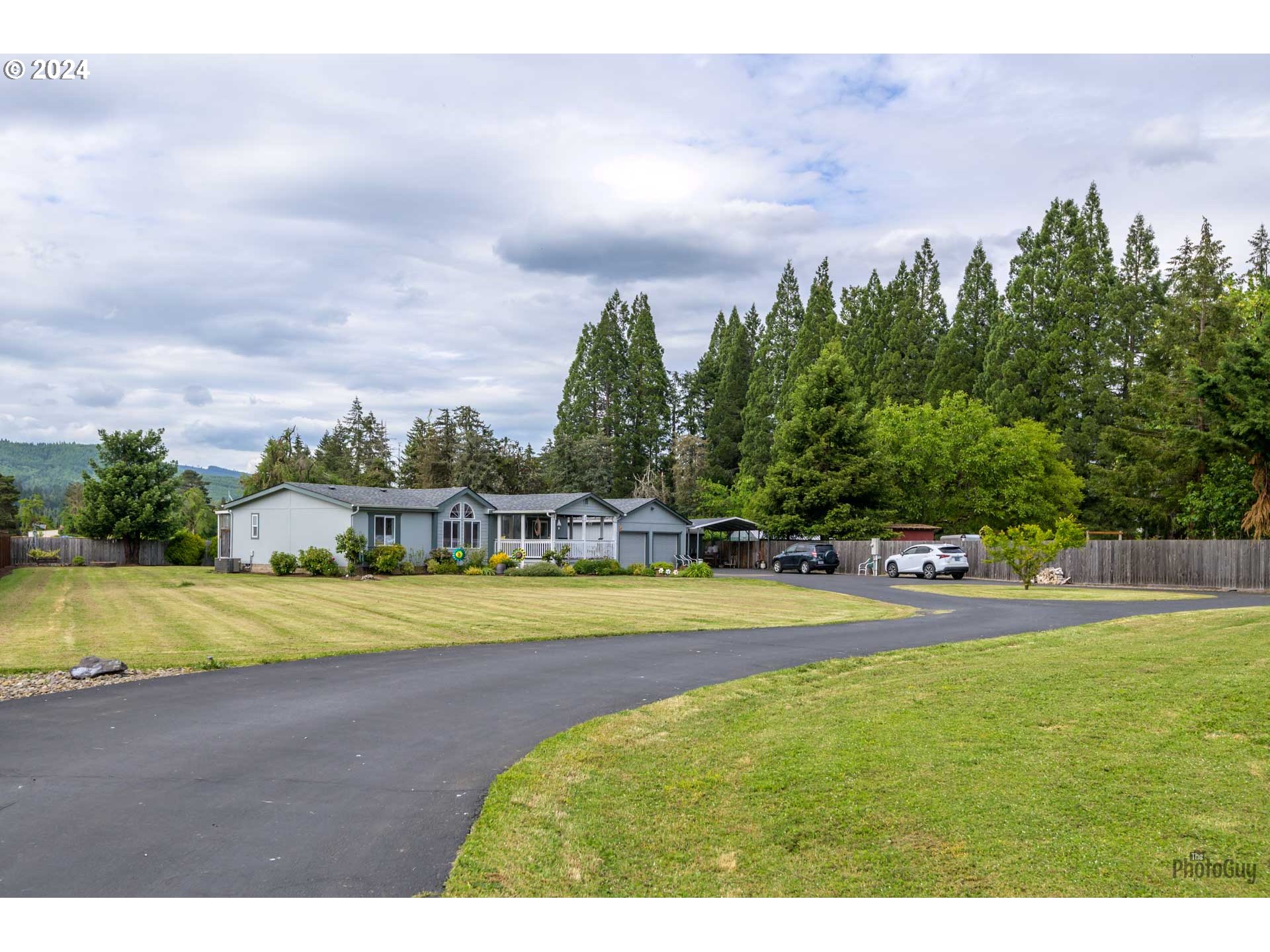 90640 Marcola Road Springfield, OR 97478 - Photo 39 of 40 a view of a swimming pool with an outdoor seating area and trees around