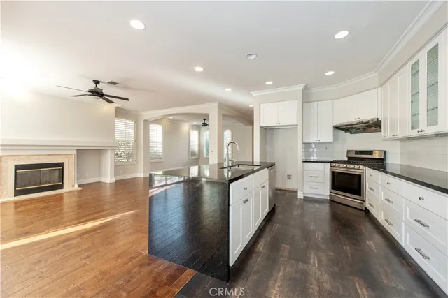 a view of small space with wooden floor and windows