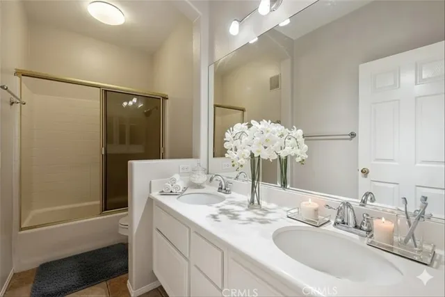 a bathroom with a sink vanity and mirror