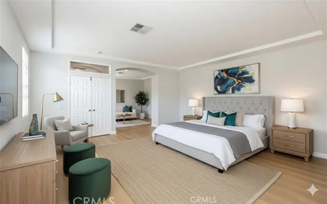 a view of a patio with couches table and chairs and potted plants