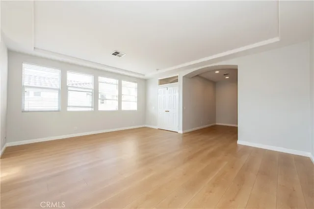 a front view of a house with swimming pool and patio
