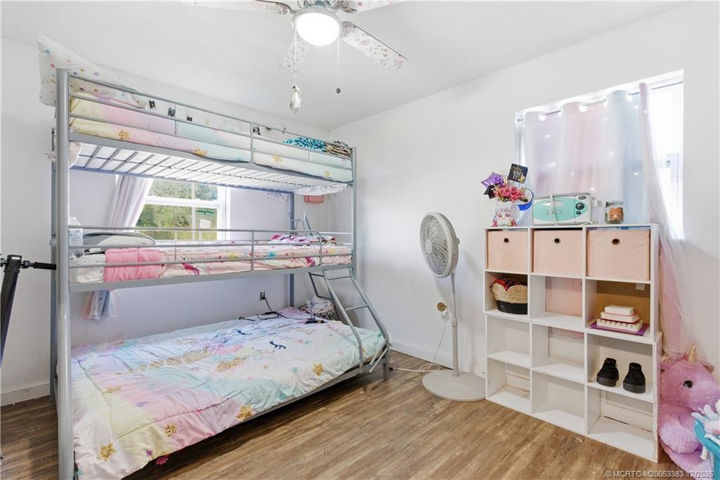 3031 Northwest 2nd Street Okeechobee, FL 34972 - Photo 13 of 19 a bedroom with a bed and a window