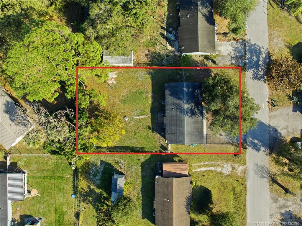 3031 Northwest 2nd Street Okeechobee, FL 34972 - Photo 2 of 19 an aerial view of residential house with outdoor space