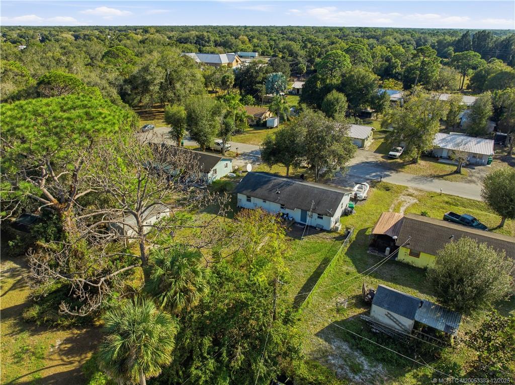 3031 Northwest 2nd Street Okeechobee, FL 34972 - Photo 3 of 19 an aerial view of a house with a yard basket ball court and outdoor seating